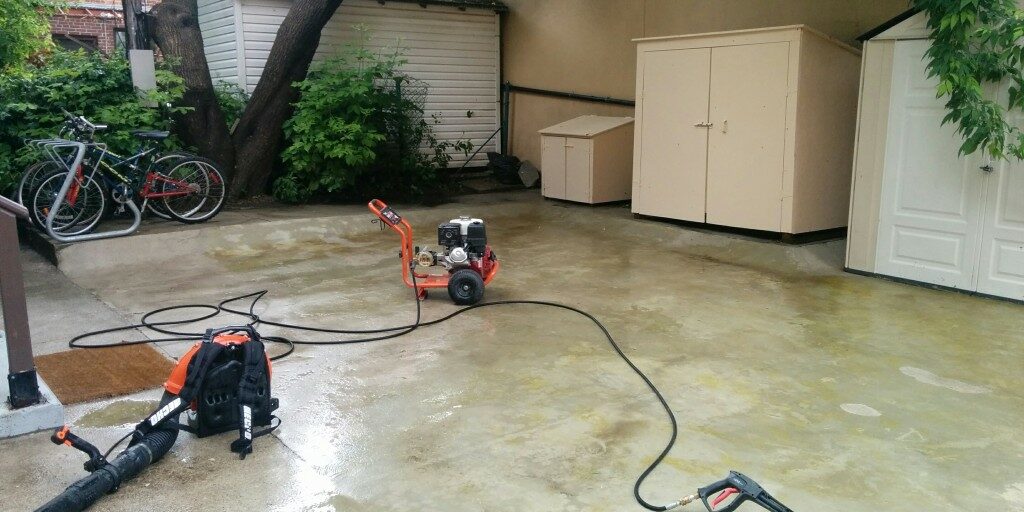 Photo of pressure washer being used for cleaning concrete by Gardenzilla in Midtown Toronto
